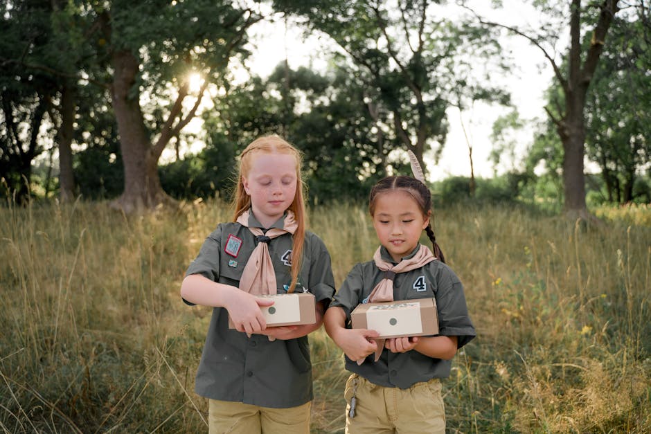 Two girls in scout uniforms symbolizing community and future growth