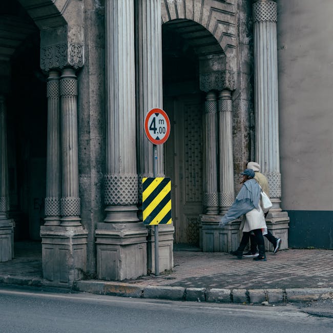 Architectural columns with people walking